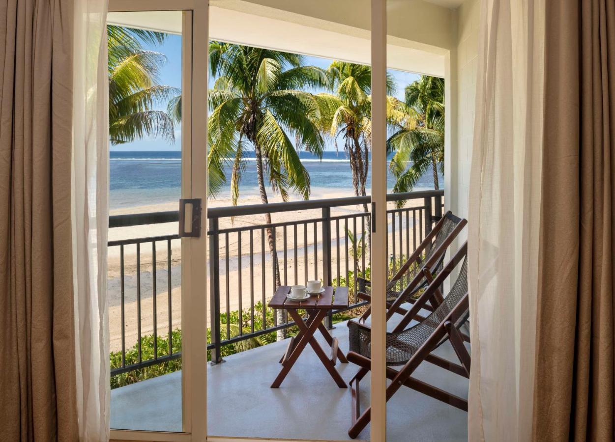 Outrigger Fiji Beach Resort Korotogo Ngoại thất bức ảnh A view of the beach from a room at the resort